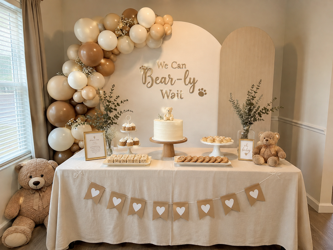 Budget friendly We Can Bearly Wait baby shower with neutral teddy bear decor balloon garland dessert table cake and DIY backdrop