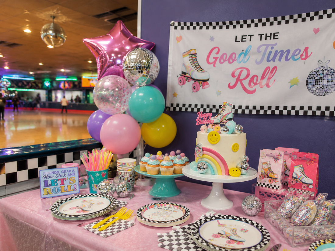 Let the Good Times Roll roller skating birthday party setup with pastel decor, disco balls, cake, balloons, and a rink in the background.
