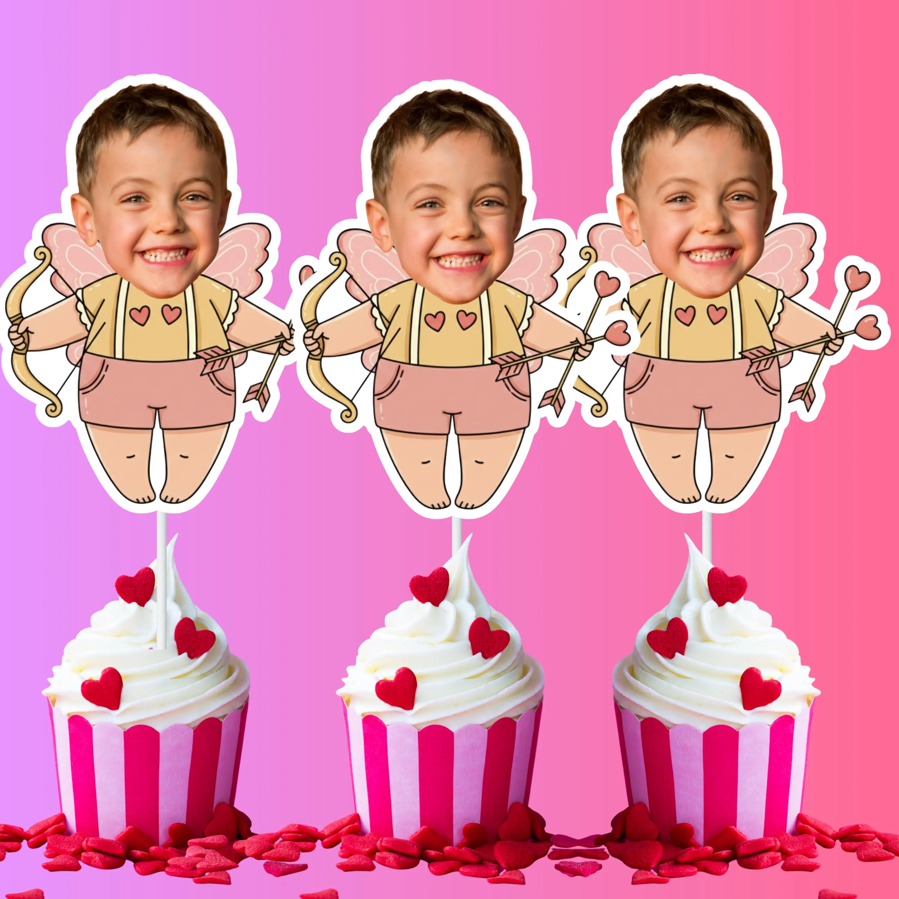 Three identical cutouts of a boy with fairy wings and a bow, above three cupcakes with pink and white frosting on a pink background.