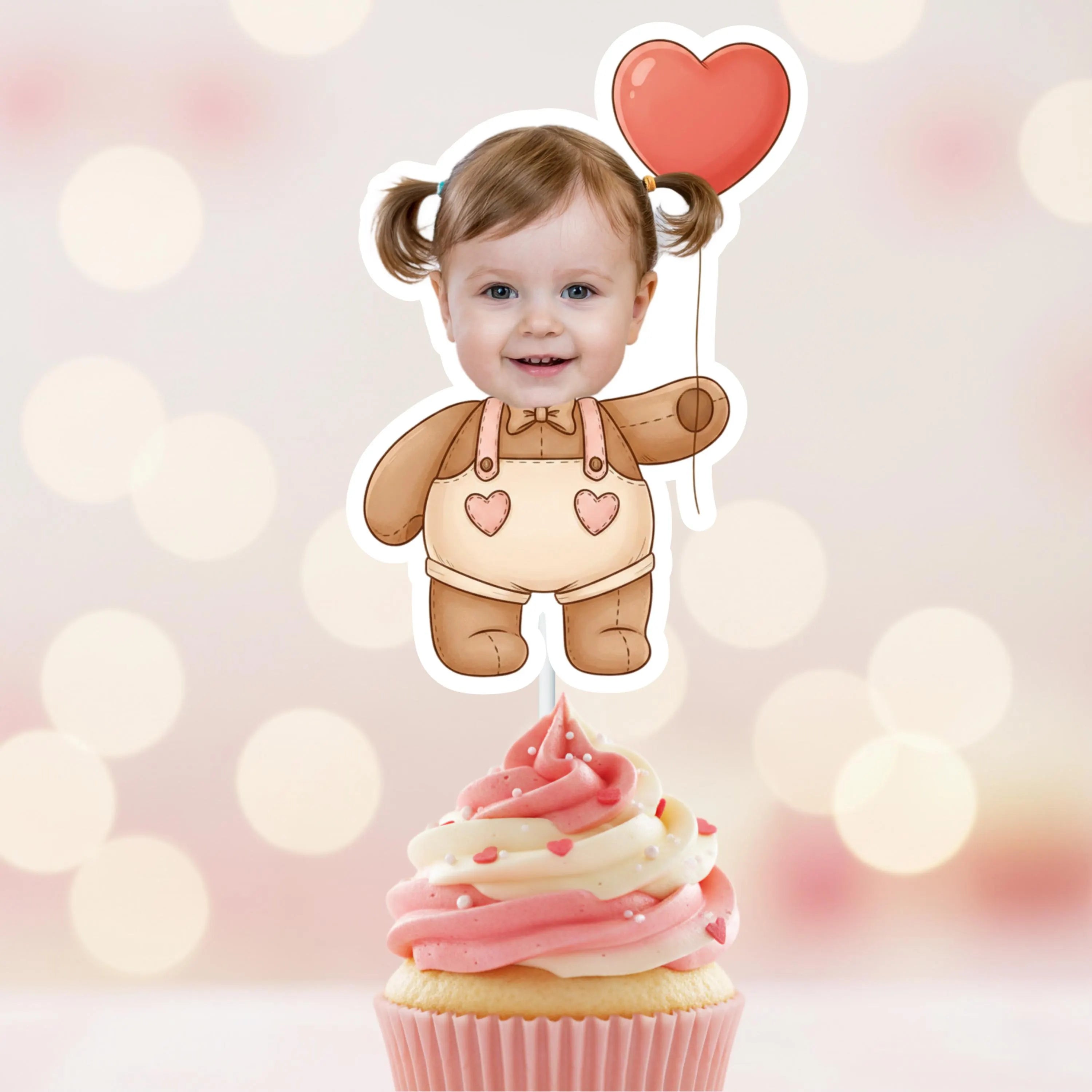 Child's photo with a heart balloon on a cupcake against a blurred light background