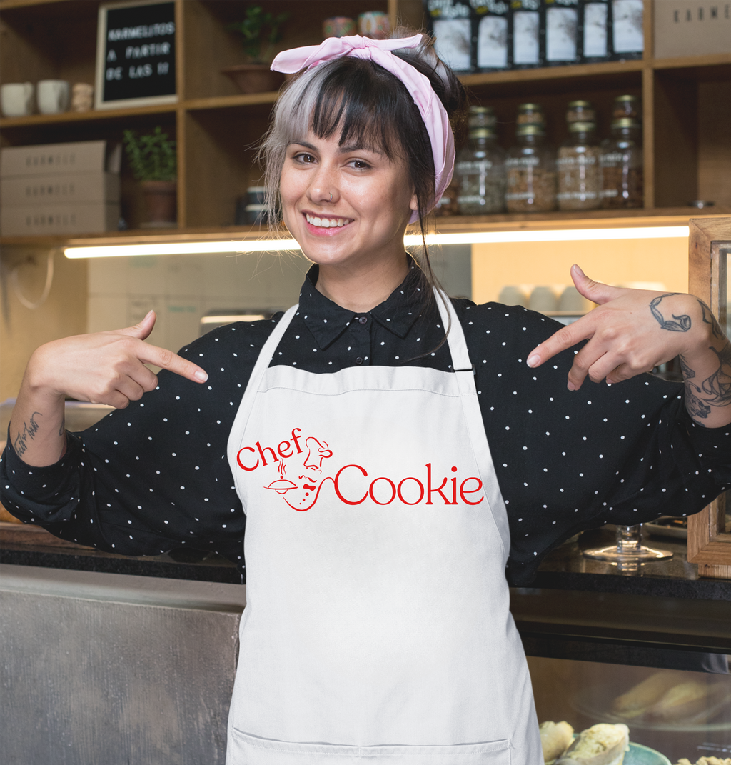 Person wearing a 'Chef Cookie' apron in a kitchen setting