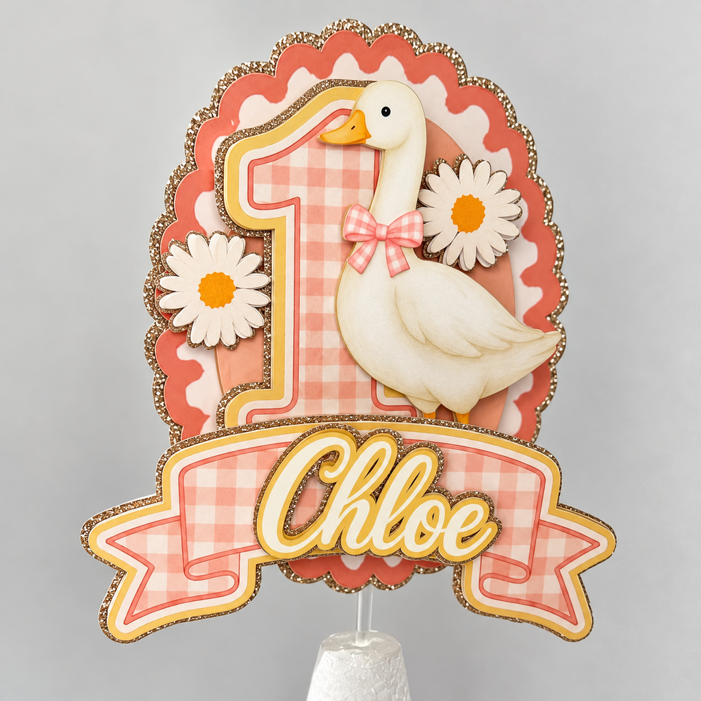 Personalized first birthday goose cake topper for Chloe featuring a pink gingham number one, white goose with bow, daisies, coral scalloped background, and champagne gold glitter accents.
