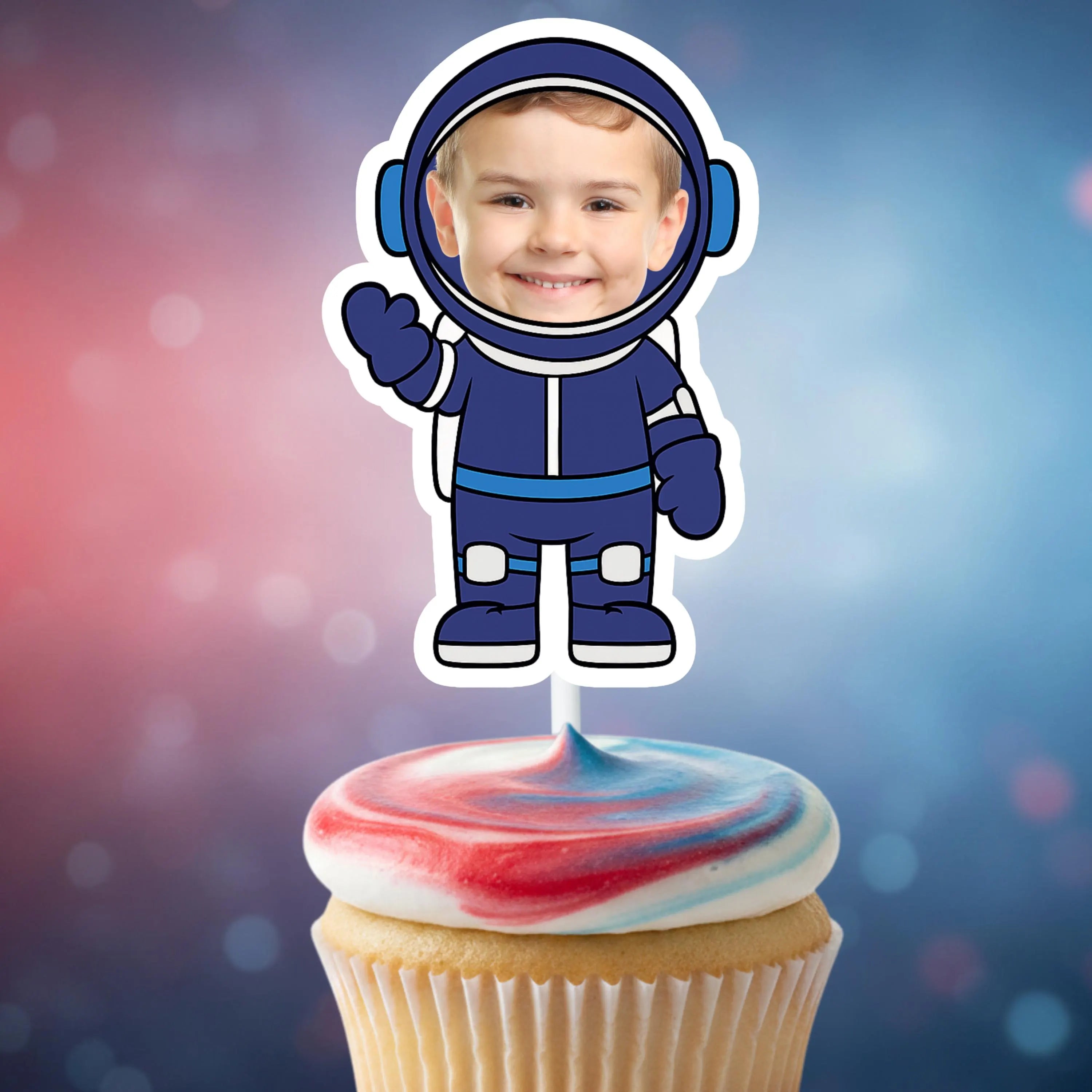 Cupcake with a space-themed topper featuring a child in an astronaut suit against a colorful background.