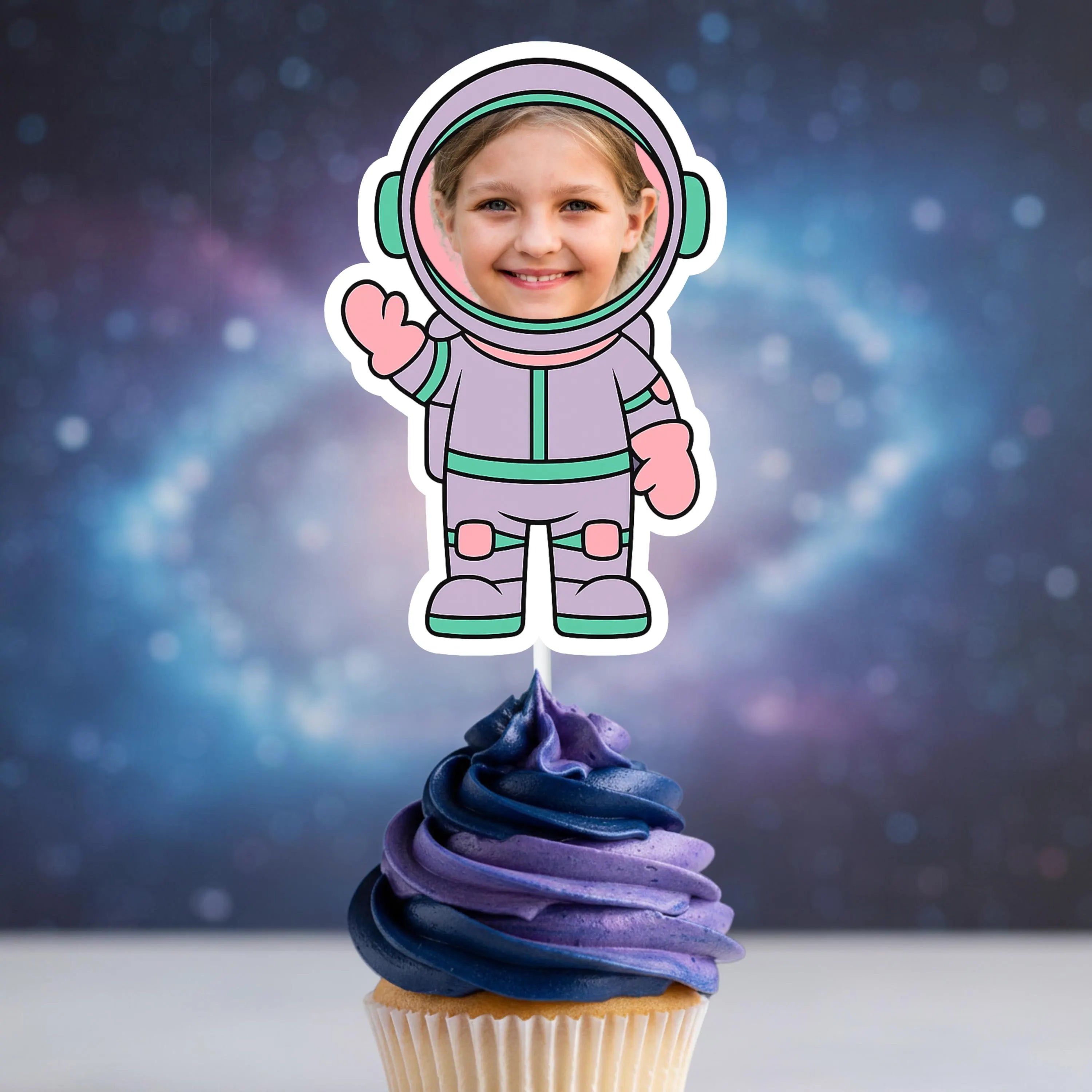 Cupcake with an astronaut-themed topper against a space-themed background