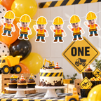 Personalized construction birthday banner featuring five child photo builder characters wearing yellow hard hats and safety vests displayed above a construction themed dessert table