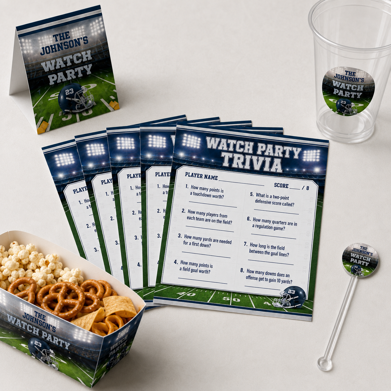 Six football trivia cards arranged with a personalized cup food tray table tent and drink stir stick.