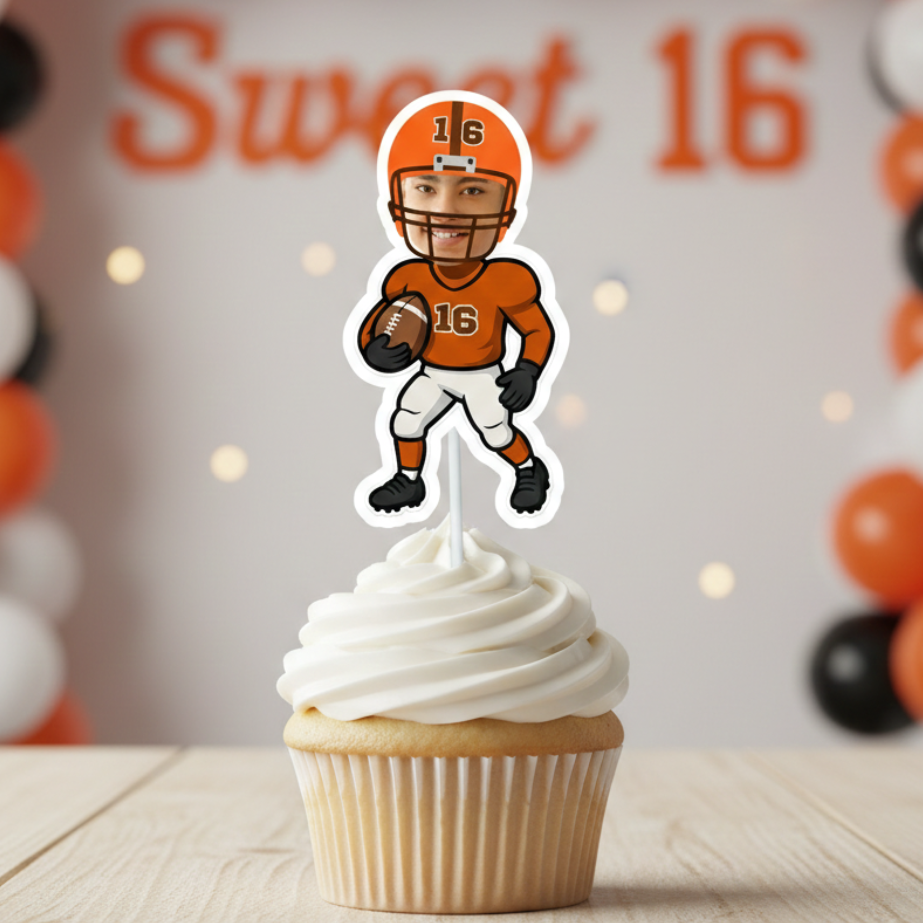 Personalized football cupcake topper designed for a Sweet 16 birthday party, featuring an orange helmet and jersey with the number 16 and a custom photo face. Styled on a frosted cupcake with orange and black balloon decor in the background, this teen football birthday decoration is ideal for a sports themed sixteenth birthday celebration. Perfect for varsity football party supplies, custom cake toppers with photo, and milestone teen birthday dessert table decor.