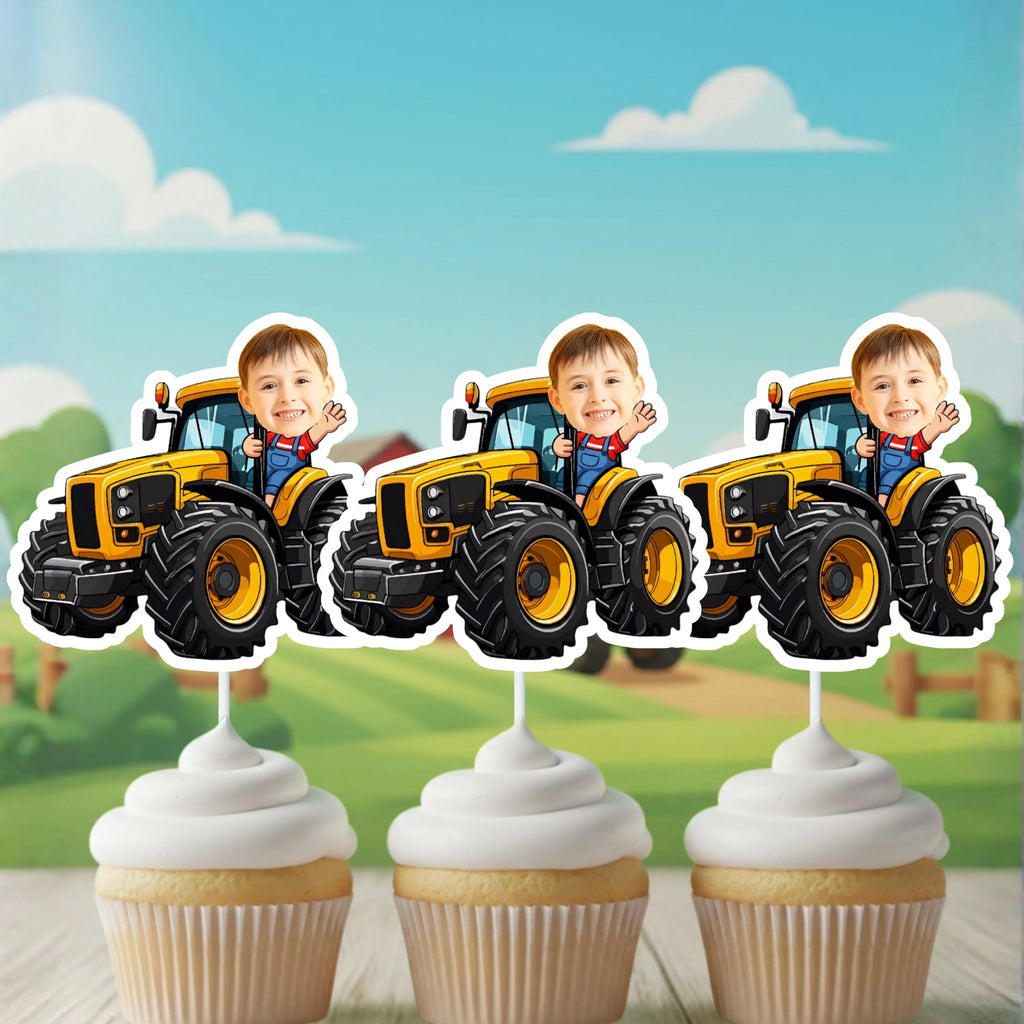Close-up of a personalized yellow tractor cupcake topper with child photo, mounted on a cupcake with white frosting. A perfect addition to farm themed birthday party decorations and tractor first birthday smash cake setups.
