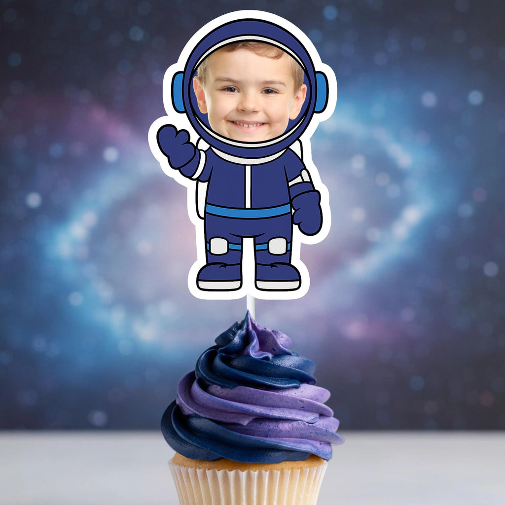 Personalized astronaut photo topper for boys featuring a deep blue spacesuit on a red and blue swirled frosting cupcake.
