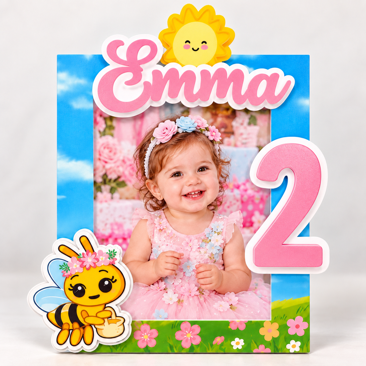 Personalized second birthday photo frame for Emma with number two, layered cardstock flowers, bee and sunshine details for a garden birthday party.