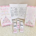 First Birthday Castle Coloring Book party favor display featuring a personalized fairytale castle coloring book, custom crayon boxes, princess-themed activity pages, and matching thank you sign. Perfect for castle birthday parties, princess first birthdays, royal birthday celebrations, fairytale birthday favors, birthday activity books, kids party favors, and personalized coloring book party favors.