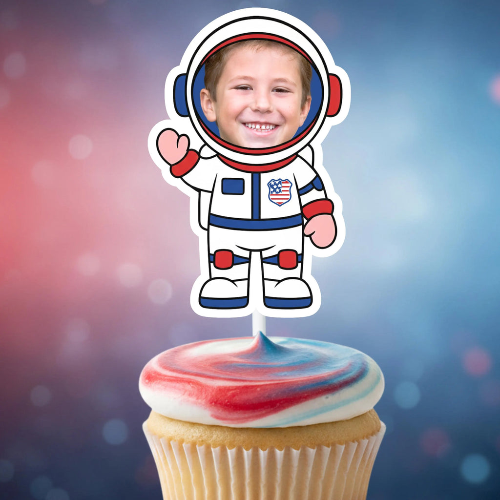 Cupcake with red, white, and blue frosting topped with an astronaut cupcake topper against a colorful background.