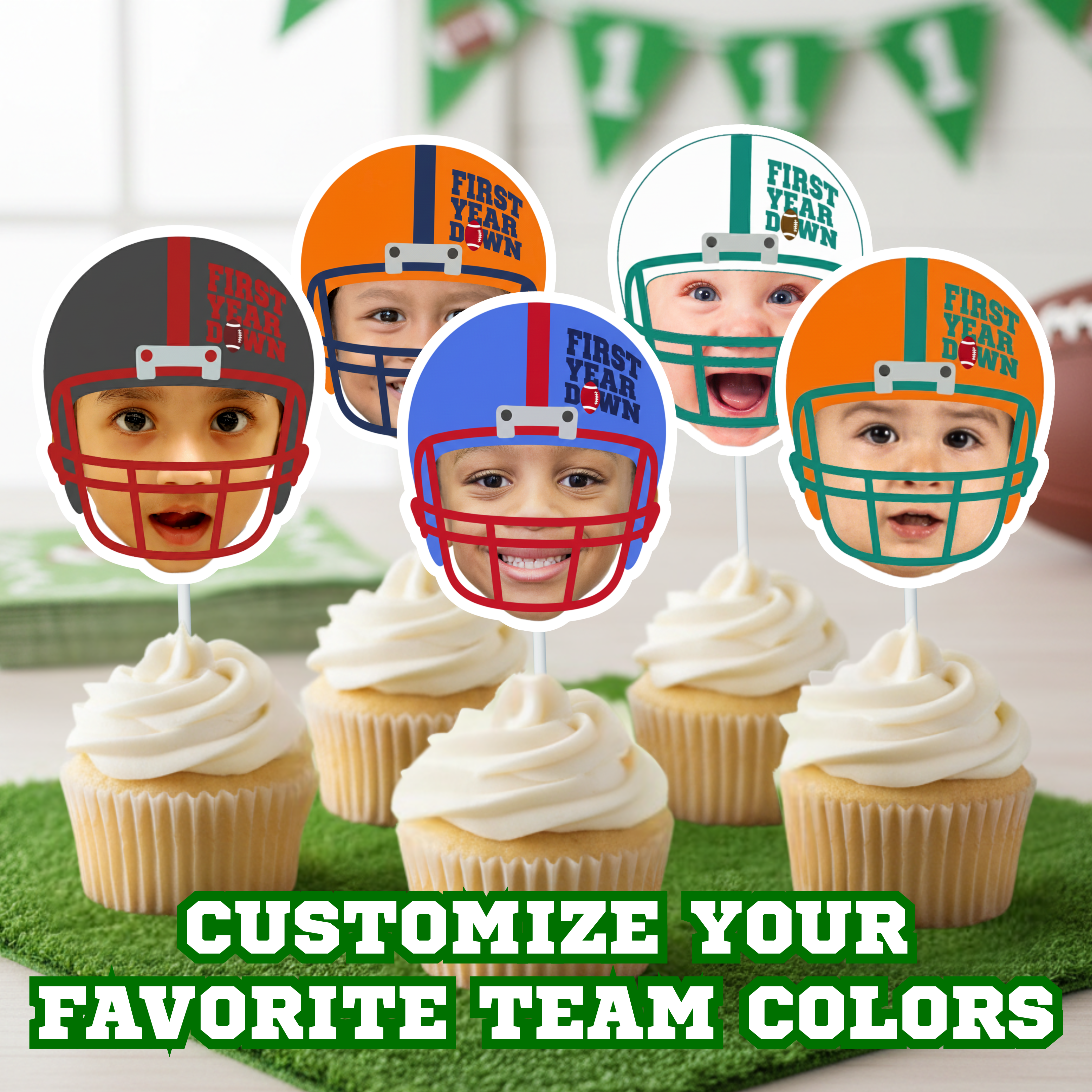 Five personalized football first birthday cupcake toppers featuring baby face football helmets in green, orange, blue, red, and black team color variations displayed on white frosted cupcakes. First Year Down football theme party decorations styled on green turf with football birthday banner background. Customizable sports birthday cupcake decorations for boys first birthday celebration. Image text reads, "Customize your favorite team colors". 