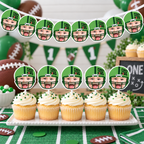 Matching personalized First Year Down football photo banner and cupcake toppers featuring a child face in a green football helmet for a coordinated first birthday party display