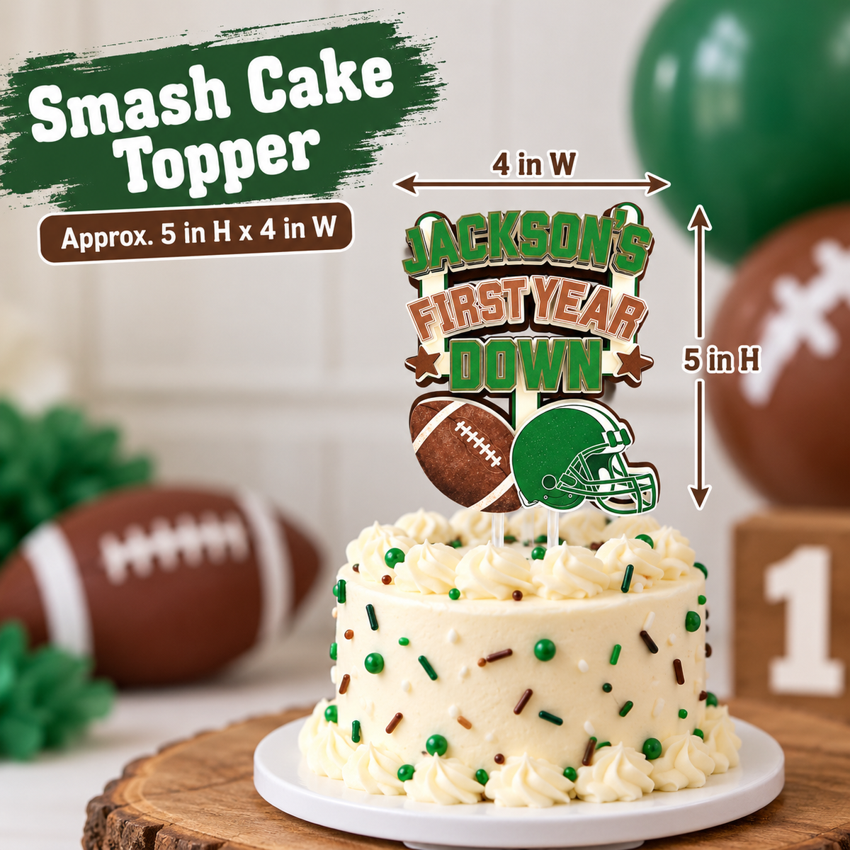 First Year Down football smash cake topper shown at approximately 5 inches tall by 4 inches wide on a small first birthday cake