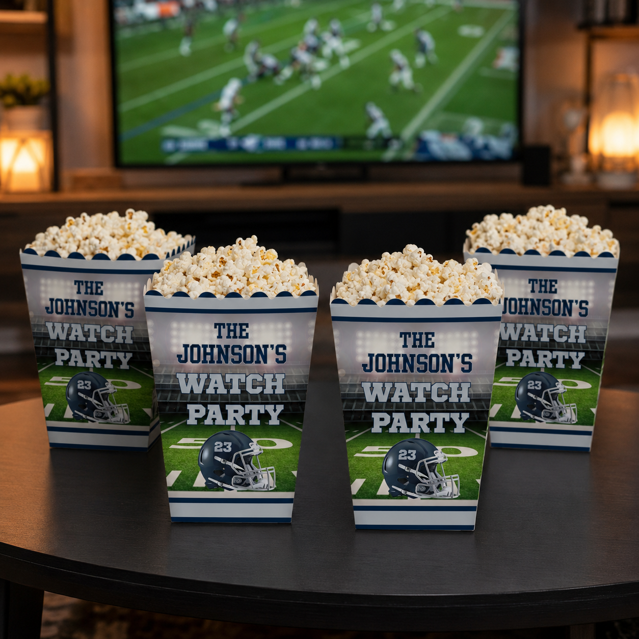 Personalized football popcorn containers filled with popcorn for an adult game day watch party