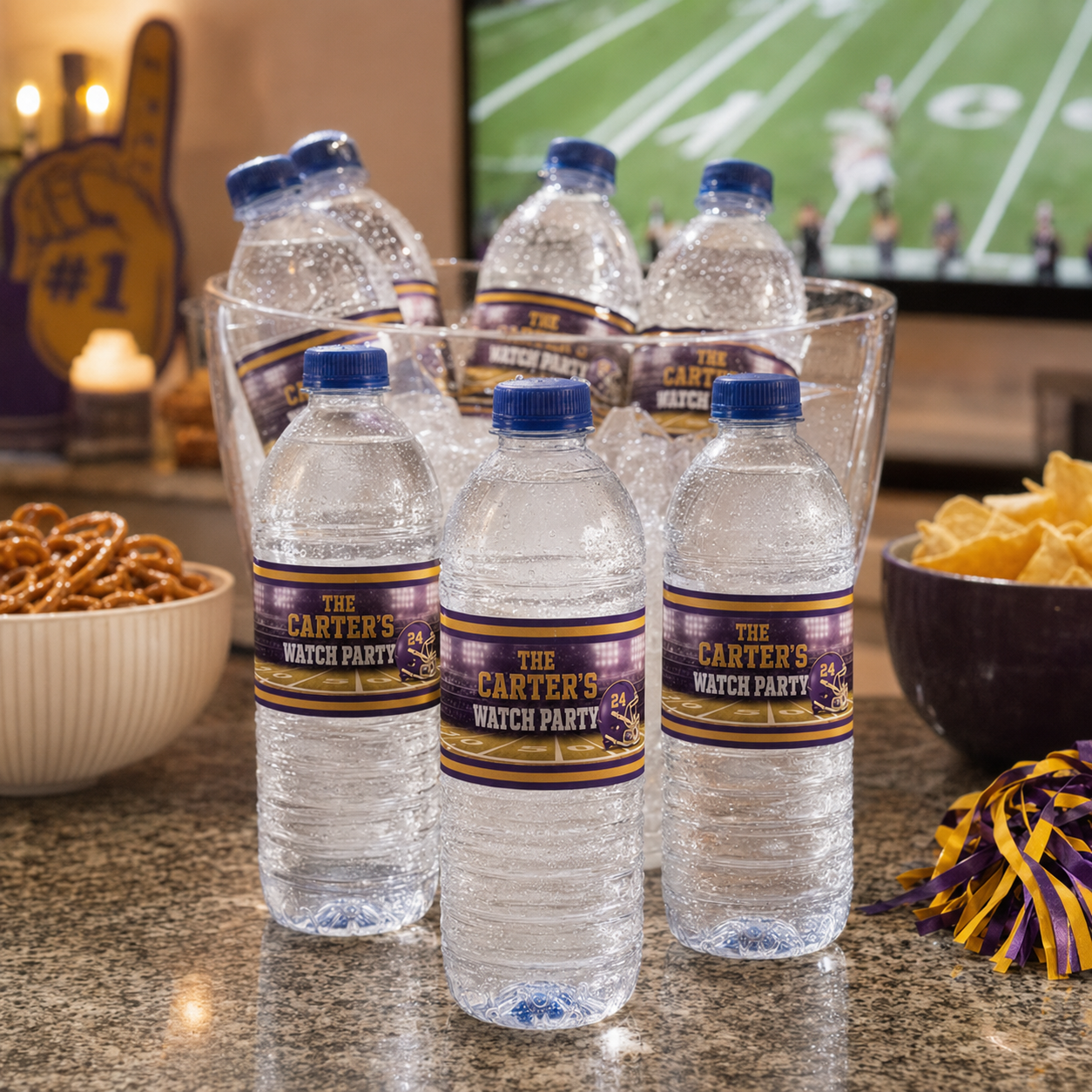 Purple and gold personalized football water bottles arranged at a home watch party with Carter family wording and helmet number 24.