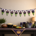 Purple and gold Go Team football banner displayed above a game-day food and beverage table.