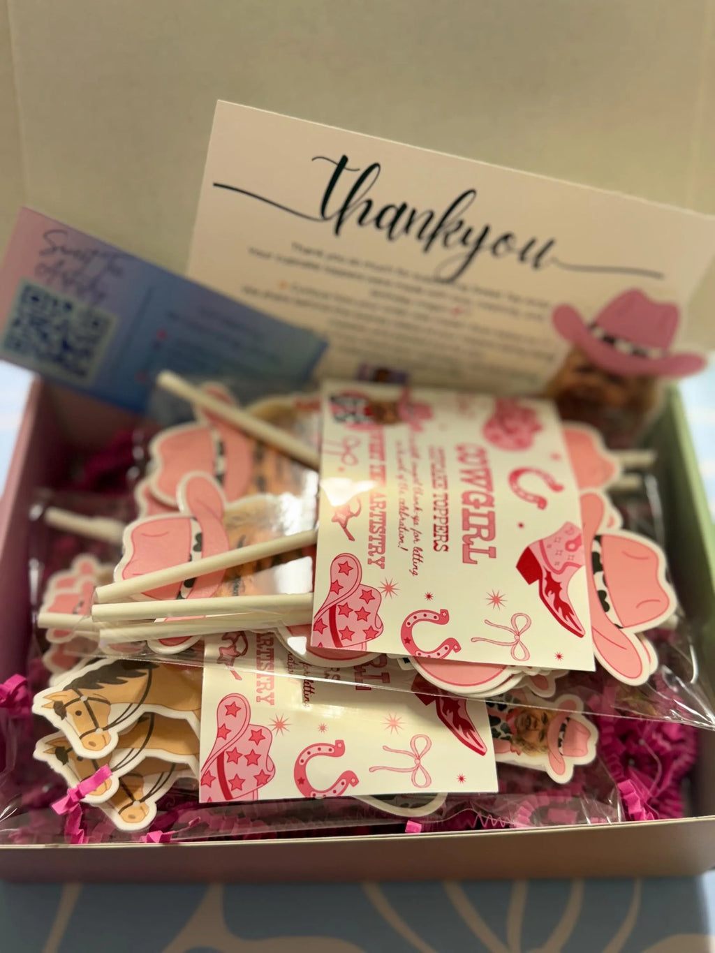 Box of decorative stickers with a 'thank you' card inside, featuring pink and white designs.
