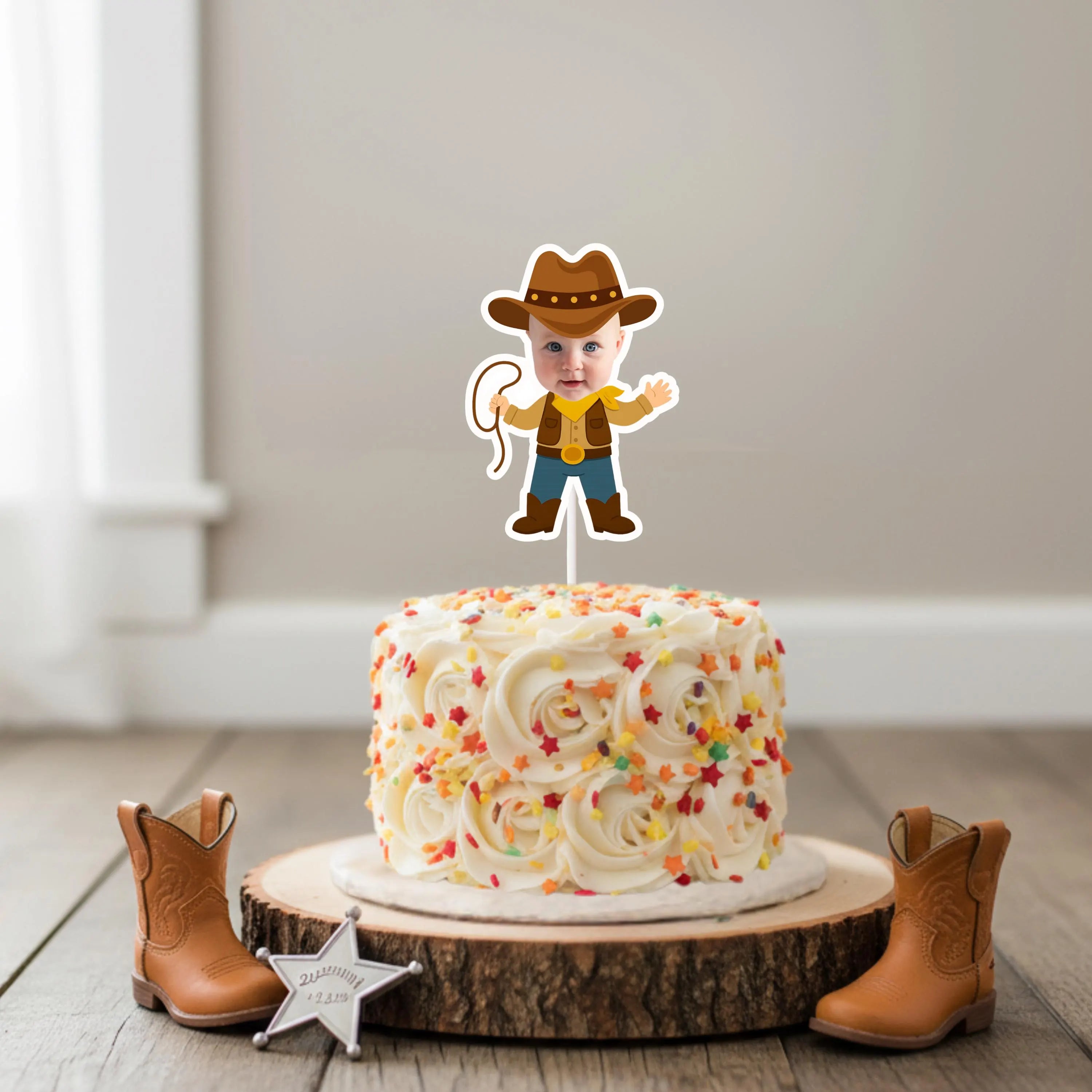 Cake with a cowboy-themed topper on a wooden stand, surrounded by cowboy boots and a star decoration.