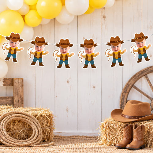 Personalized My First Rodeo cowboy photo banner displayed above a rustic cake and cupcake table with yellow brown and cream balloons hay bales rope cactus and western party decorations