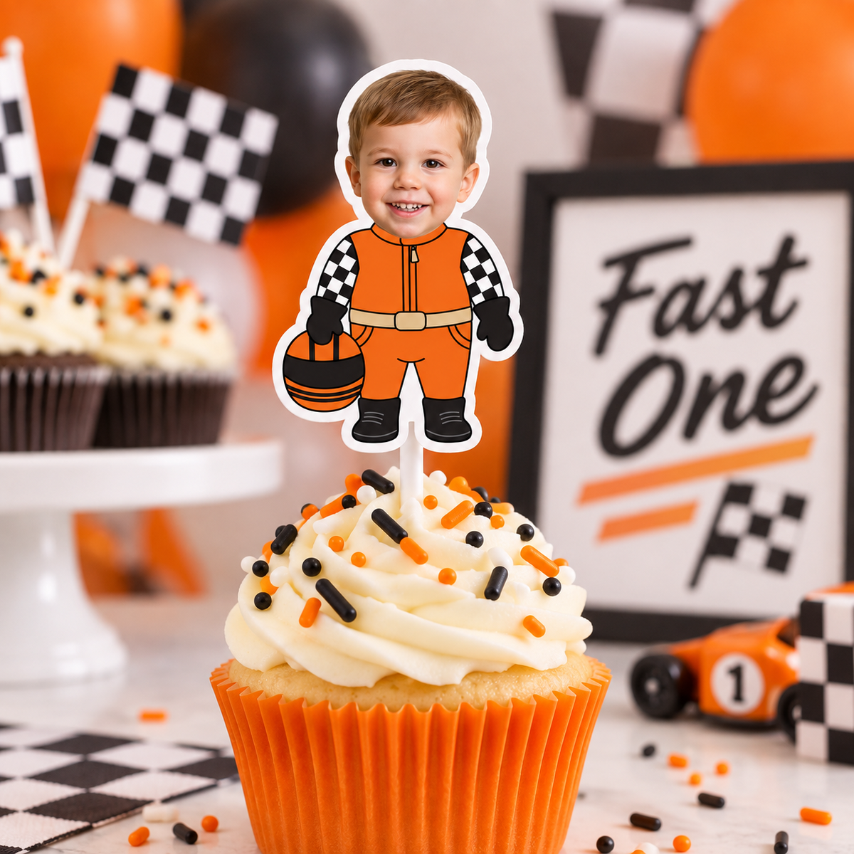 Orange Fast One personalized photo cupcake topper featuring a child as a race car driver for a first birthday racing theme