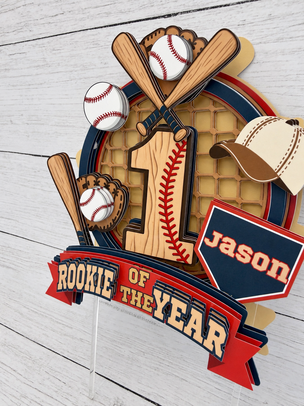 Personalized Rookie of the Year baseball cake topper with name Jason, age 1, bats, baseballs, glove and layered red navy and cream design
