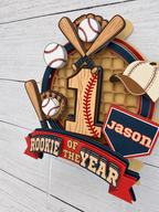 Personalized Rookie of the Year baseball cake topper with name Jason, age 1, bats, baseballs, glove and layered red navy and cream design