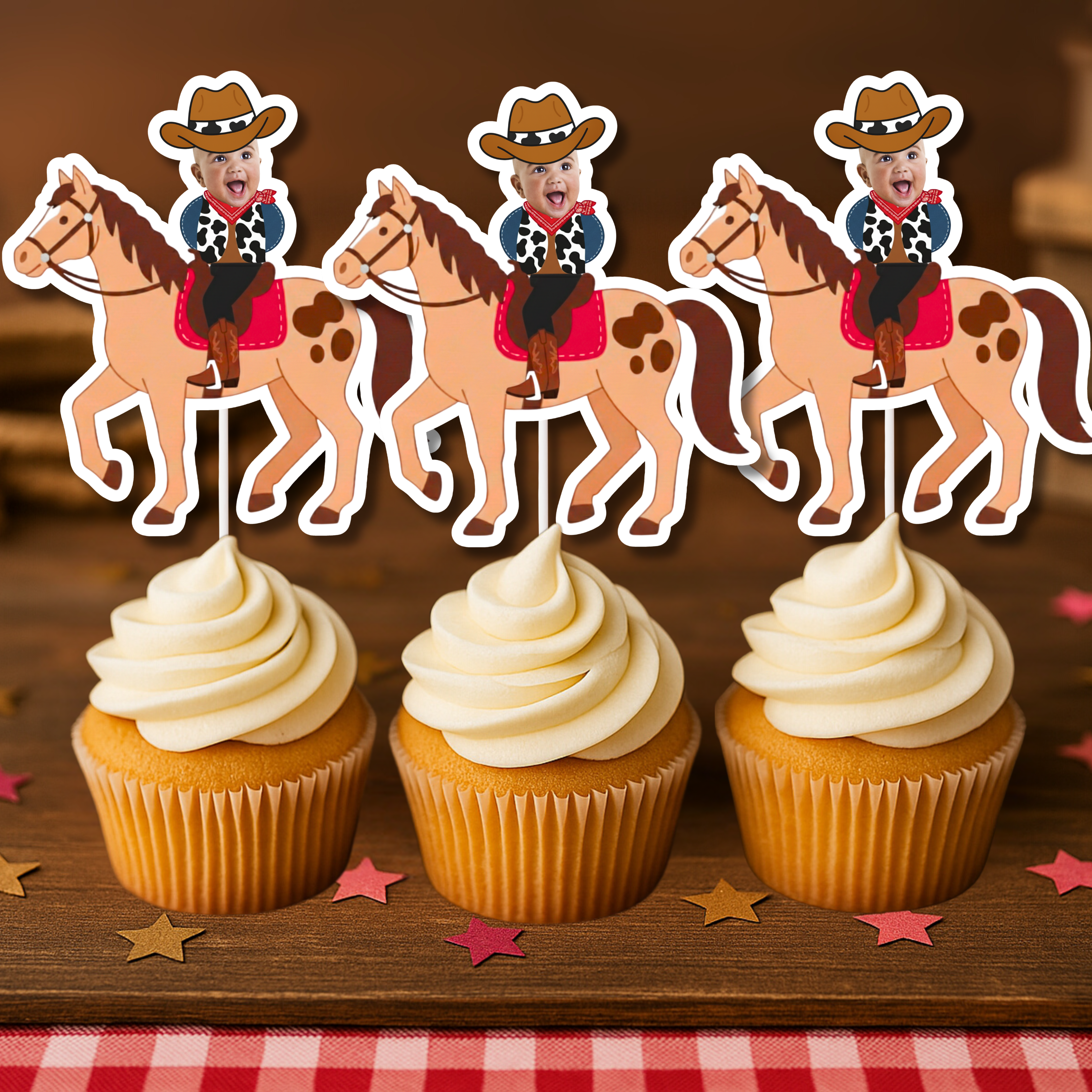 Close up of personalized cowboy baby photo cupcake toppers featuring a smiling infant’s face wearing a brown cowboy hat, red bandana, and cow print vest, mounted on western horse cutouts and displayed on vanilla cupcakes with buttercream frosting. These custom photo cupcake decorations are perfect for cowboy first birthday parties, wild west baby celebrations, rodeo themed smash cake sessions, country western milestone birthdays, and barnyard themed dessert tables. Designed to highlight the child’s photo. 