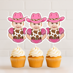 Custom pink cowgirl cupcake toppers featuring a baby photo in a cow print western outfit with pink bandana sleeves and a pink cowboy hat, displayed on vanilla cupcakes with white frosting. These personalized western cupcake toppers are perfect for “My First Rodeo” first birthday parties, cowgirl themed birthday celebrations, country western baby showers, barnyard girl birthday themes, and rustic rodeo party dessert tables. Ideal for smash cake sessions, milestone birthday décor, western baby girl party deco