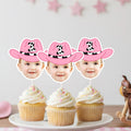 Three cupcakes with pink cowboy hats on top, featuring cutouts of children's faces.