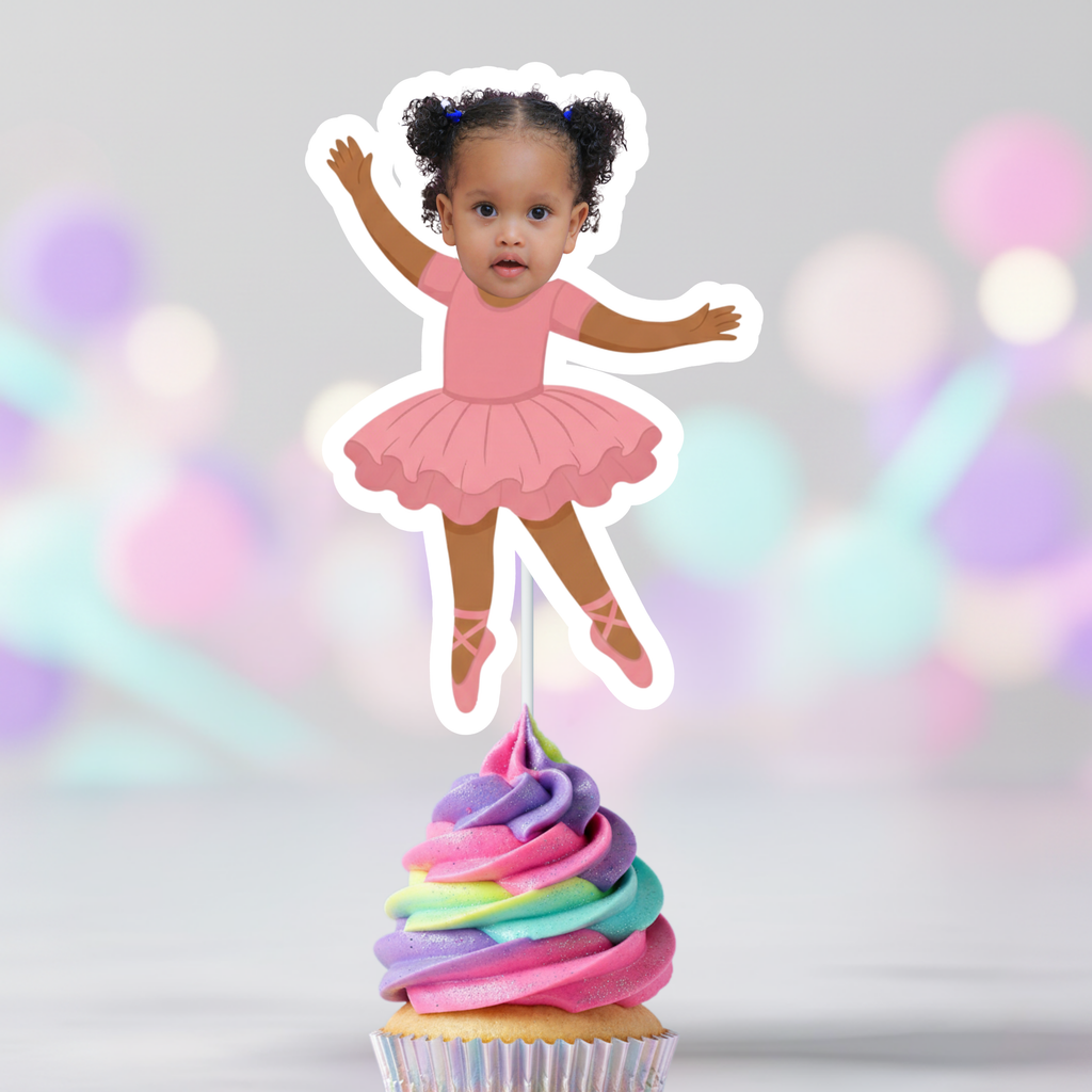 Cupcake with rainbow frosting and a ballerina-themed cake topper on a blurred colorful background