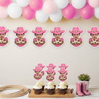 Pink cowgirl themed birthday banner and matching personalized cupcake toppers featuring a baby photo in a western outfit with a pink cowboy hat, styled under a pink and white balloon garland for a “My First Rodeo” party. This western birthday decoration set includes custom photo cupcake toppers and coordinating party banner panels perfect for cowgirl first birthday themes, rodeo baby shower décor, country western birthday parties, and rustic pink barnyard celebrations. Designed for dessert tables, high chai