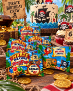 Personalized pirate Ring Pop favors displayed on a themed birthday party table with pirate cake cupcakes treasure chest and gold coins