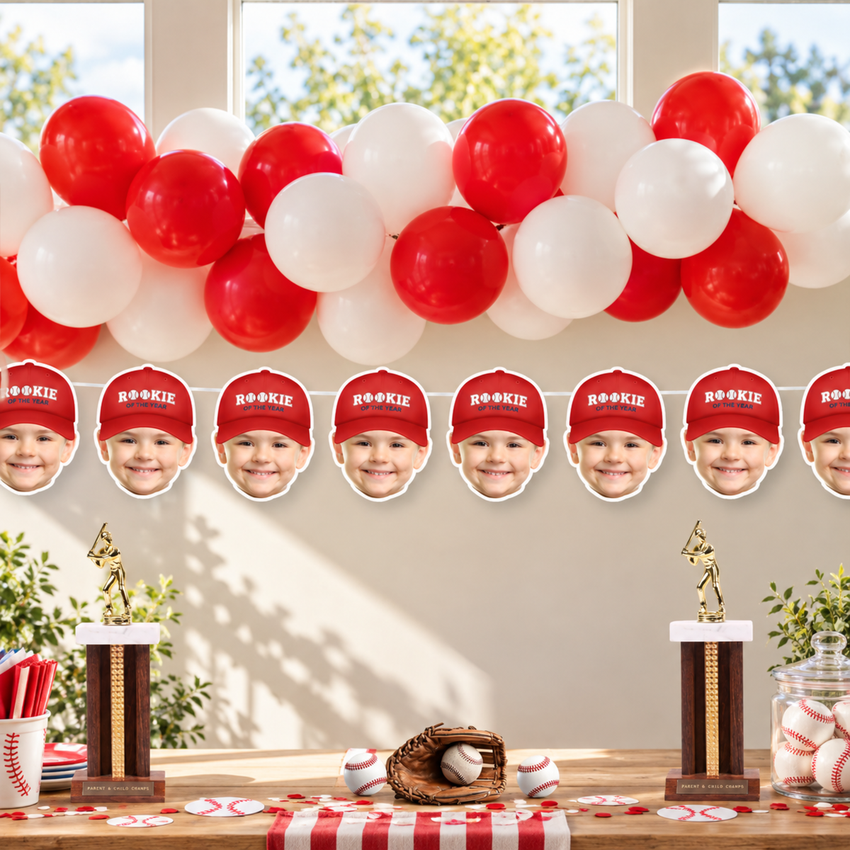Red Rookie of the Year personalized child photo banner displayed with red white balloons and baseball decorations for a baseball themed birthday party