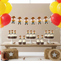 Cowboy-themed birthday party setup with a banner, cupcakes, decorations, and balloons.