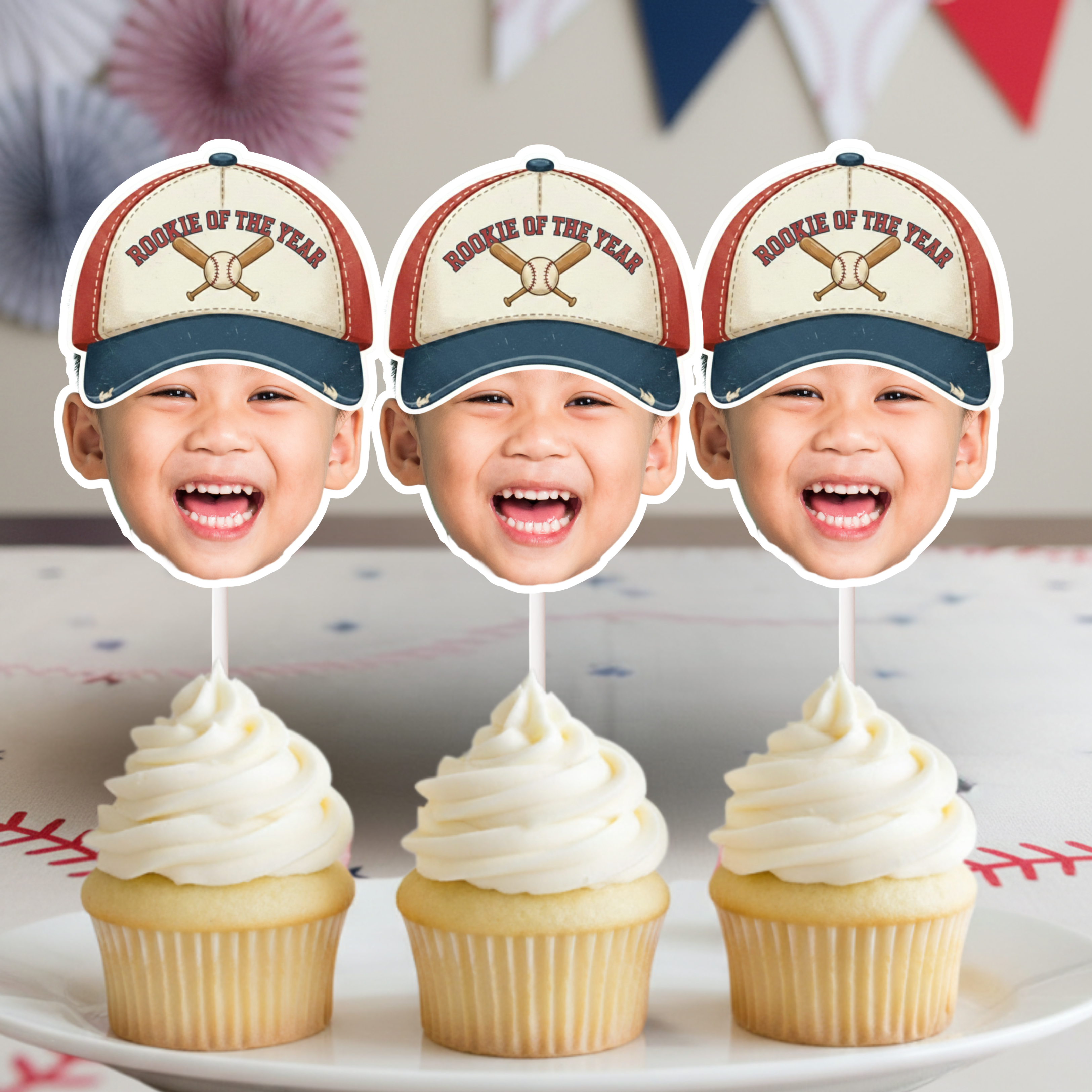 Rookie of the Year baseball birthday cupcake toppers with smiling child face cutouts on frosted cupcakes, perfect for baseball birthday party decorations, sports themed kids party and little league celebration dessert table.