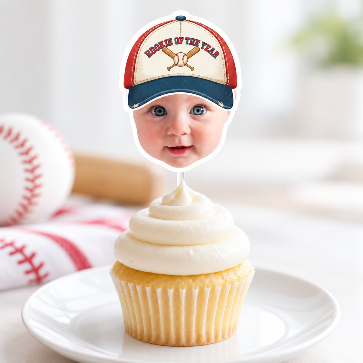 Close up of a personalized Rookie of the Year baseball cupcake topper featuring a childs photo with a vintage baseball cap on a birthday cupcake