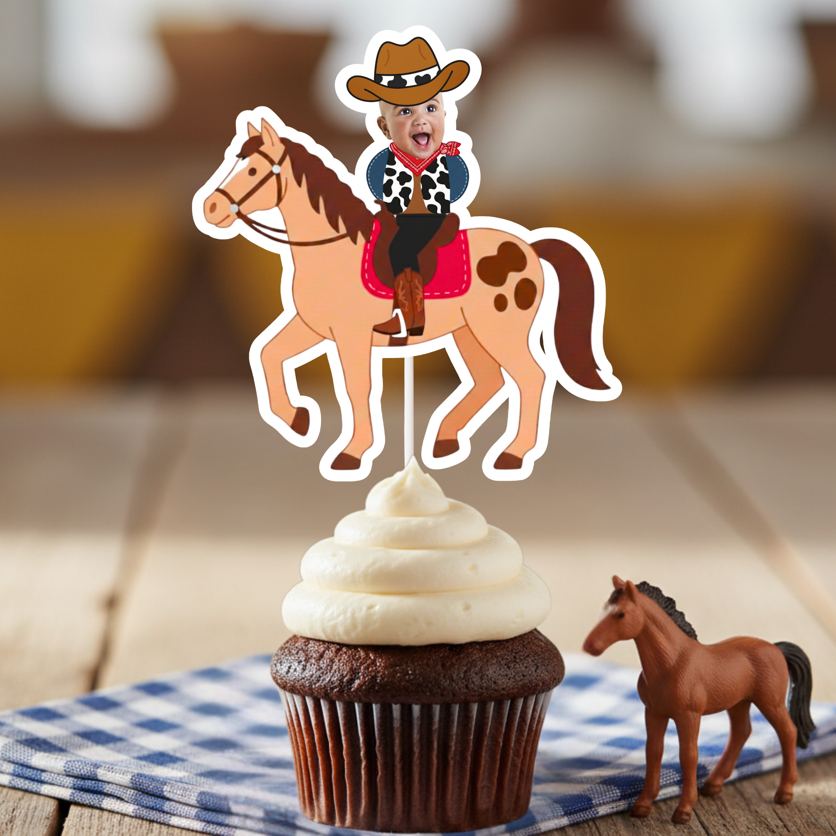 Single personalized cowboy horse cupcake topper with baby photo rider, brown hat, and red bandana displayed on chocolate cupcake. Great for cowboy first birthday parties, rodeo themes, wild west celebrations, and country western dessert décor. Ideal for smash cake styling and western party setups.