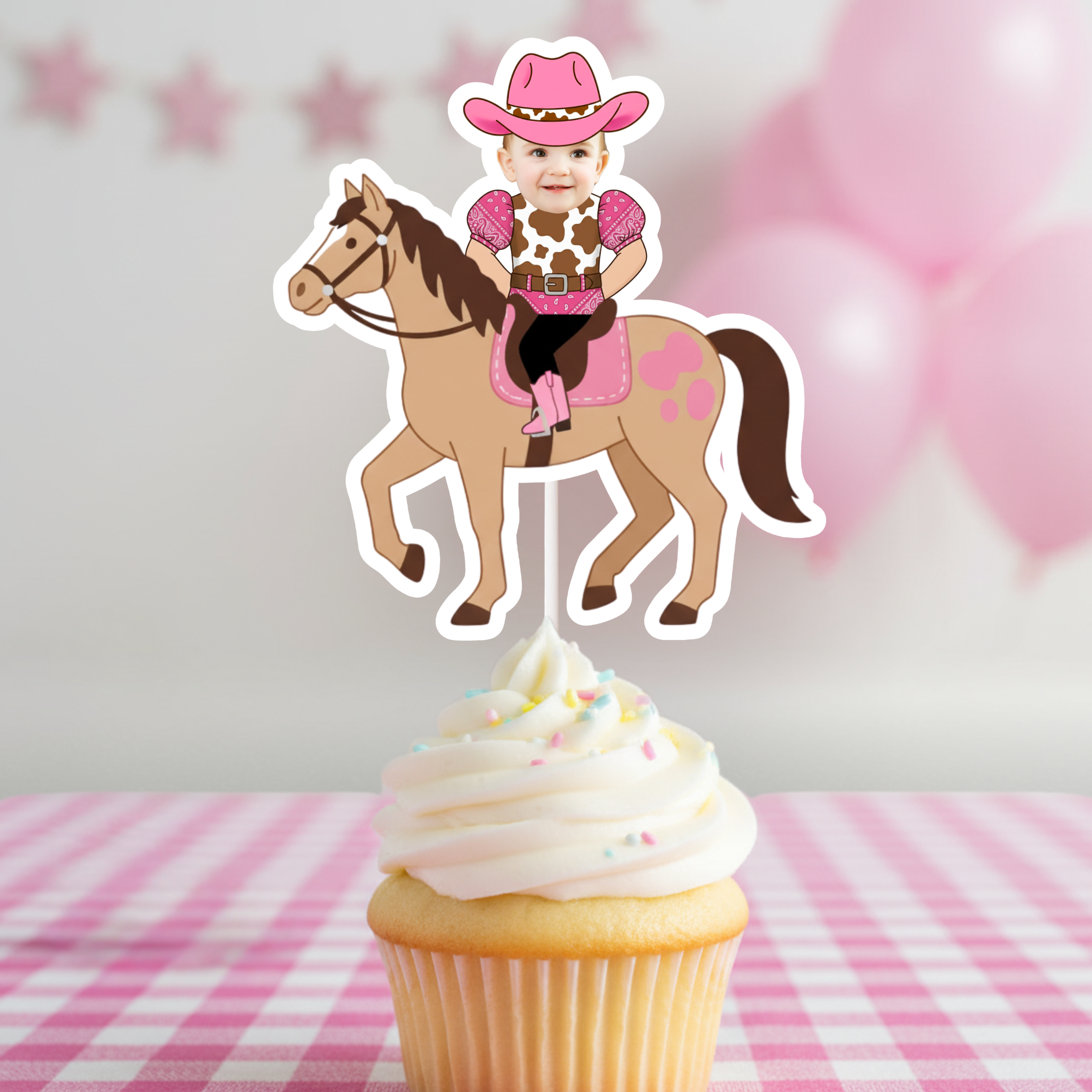 Single personalized pink cowgirl horse cupcake topper featuring a smiling baby photo riding a brown pony with pink saddle and cowboy hat, displayed on a frosted cupcake against a pink gingham party backdrop. This custom western cupcake decoration is perfect for “My First Rodeo” birthdays, cowgirl first birthday parties, pony themed celebrations, rustic barnyard events, and pink country western décor. Designed as a high quality photo cupcake pick, this cowgirl horse topper enhances smash cake styling. 