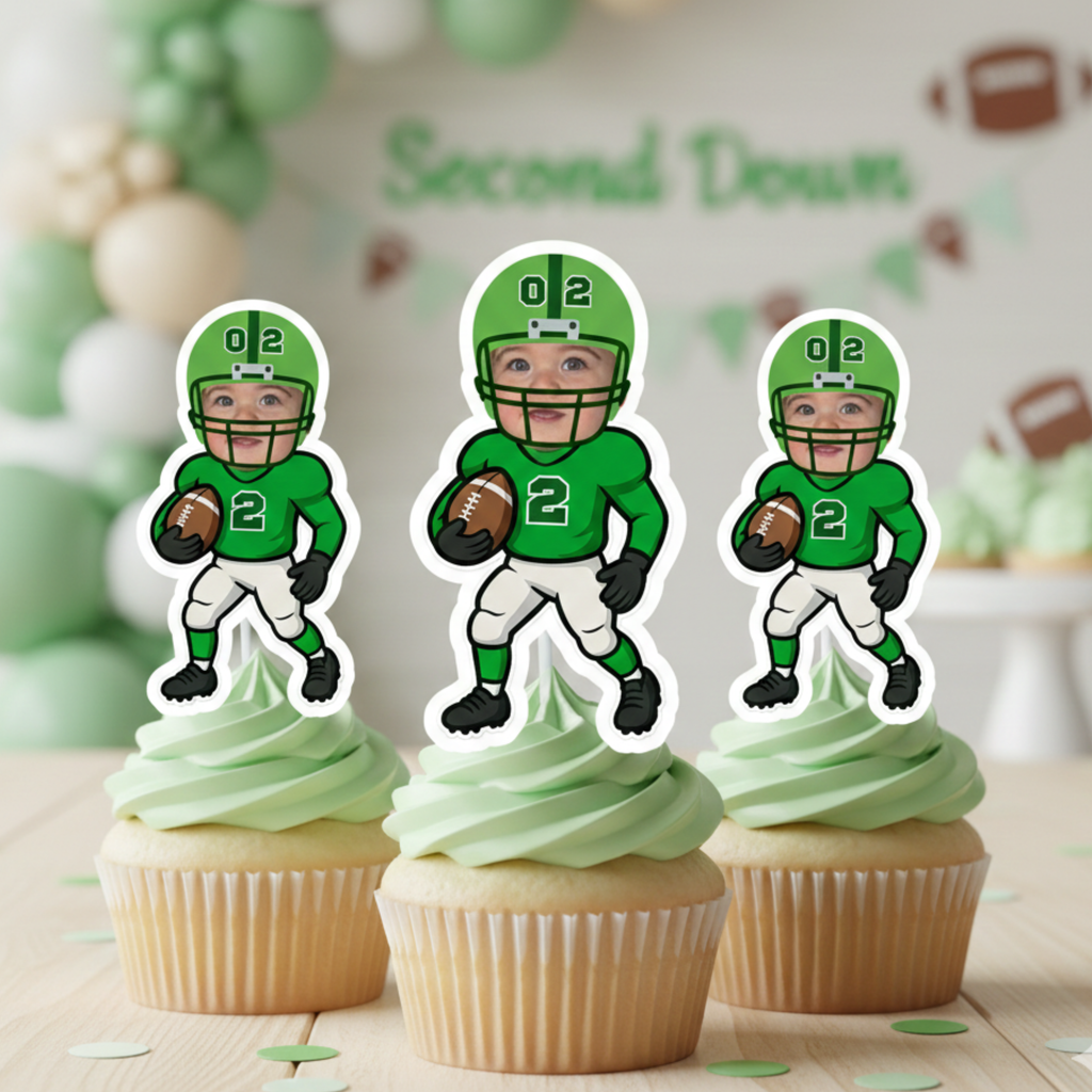 Three green football cupcake toppers featuring a personalized toddler face and number 2 jersey displayed on vanilla cupcakes with light green frosting. This custom football 2nd birthday party decoration is perfect for a “Second Down” sports-themed celebration for boys or girls. Personalized photo cupcake toppers add a unique touch to toddler birthday party desserts and football-themed events.
