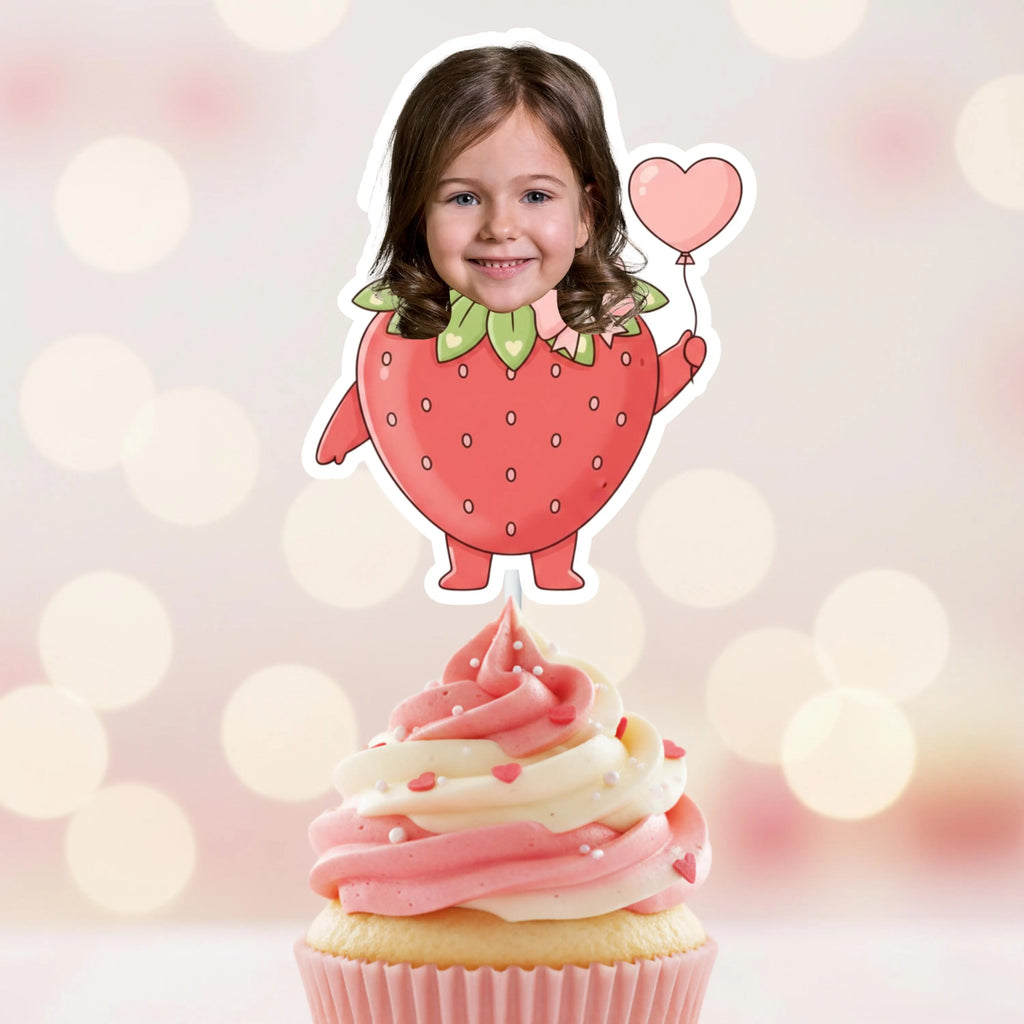 Cardboard cutout of a girl in a strawberry costume on a cupcake with pink frosting.