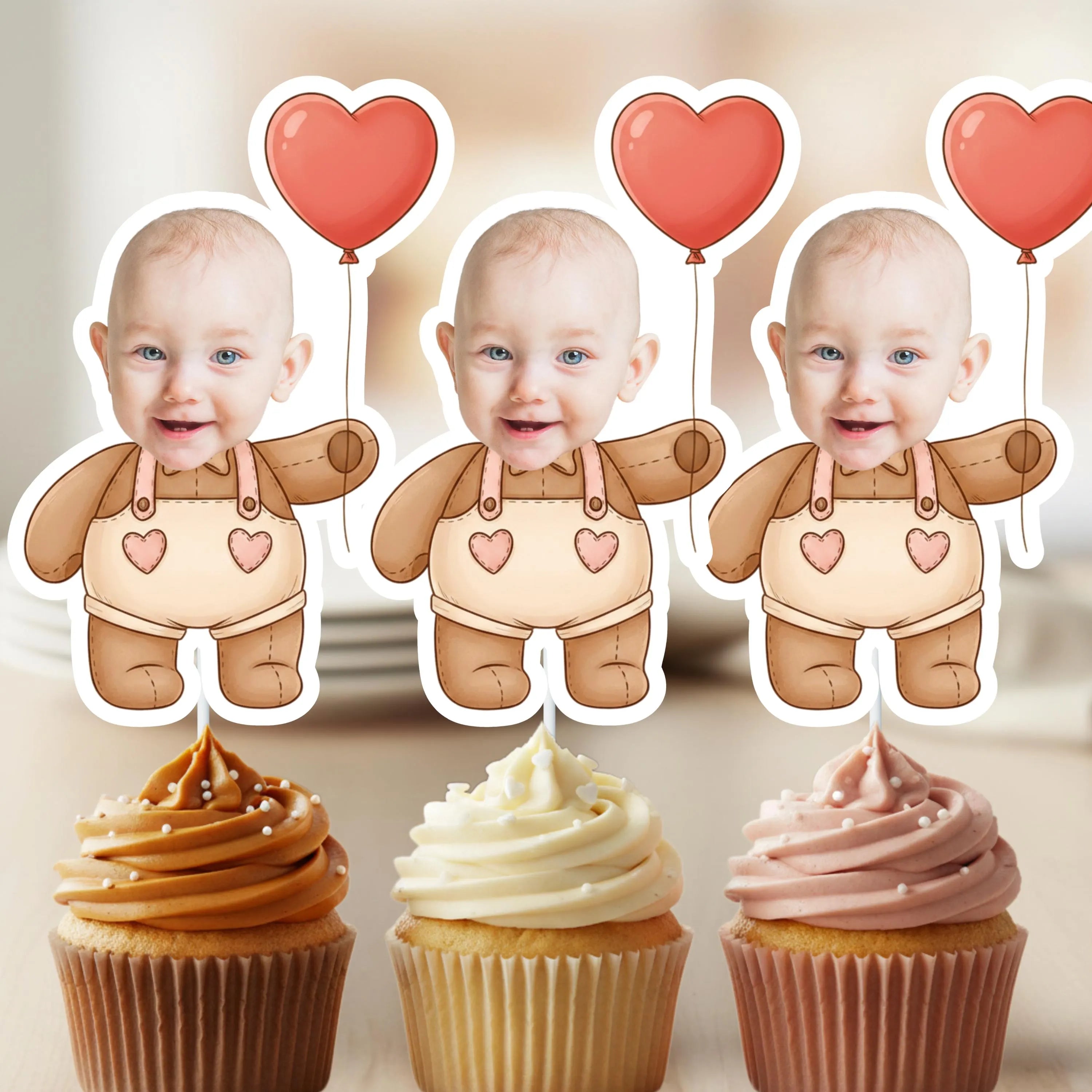 Three identical baby figures with heart balloons above cupcakes on a neutral background