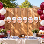 White Rookie of the Year personalized face banner displayed at an outdoor baseball birthday party with red white balloons and baseball party decorations