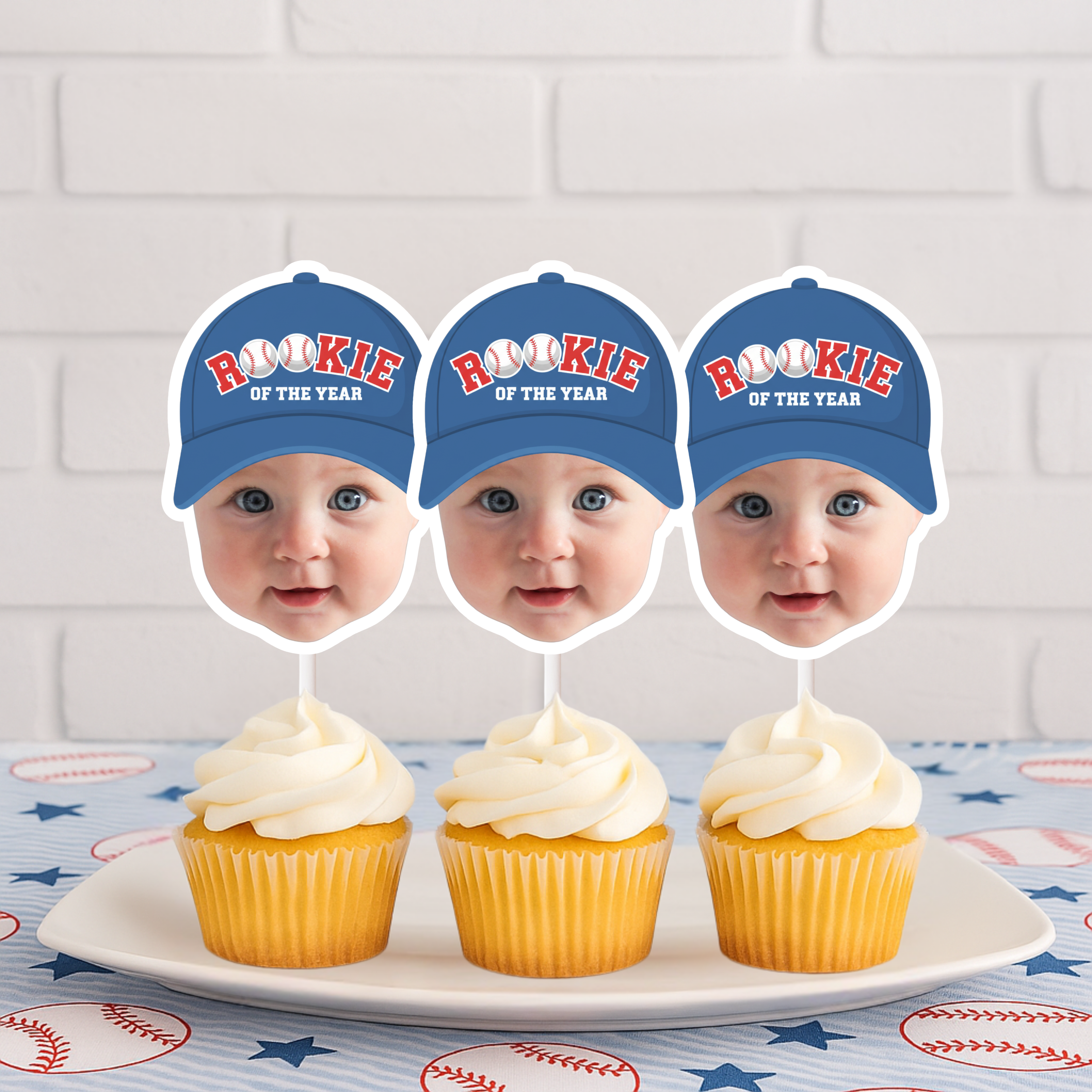 Baby Rookie of the Year baseball first birthday photo cupcake toppers with blue caps displayed on frosted cupcakes, perfect for boy first birthday sports theme and little slugger party decorations.