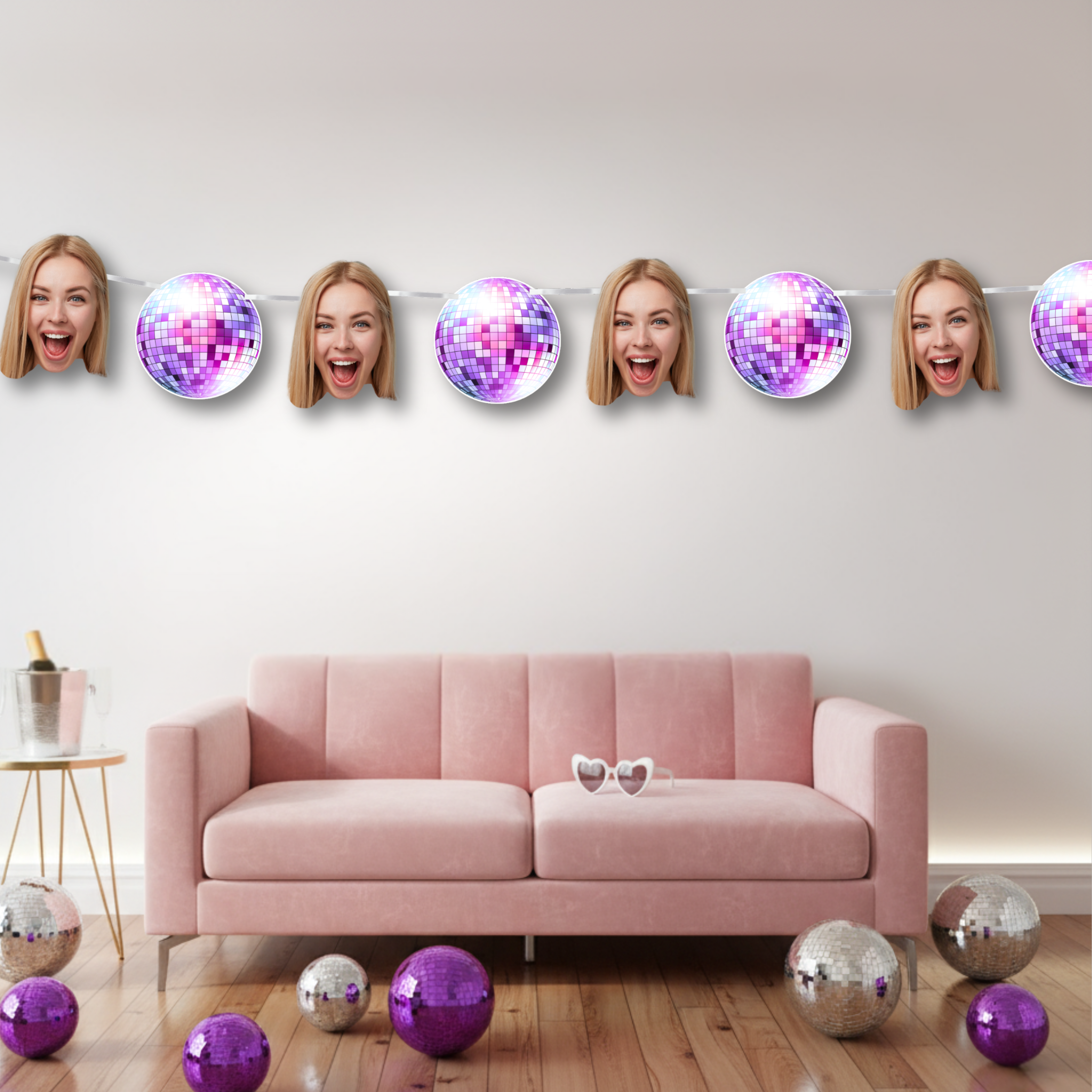 Pink sofa with disco balls and a woman's face on a wall