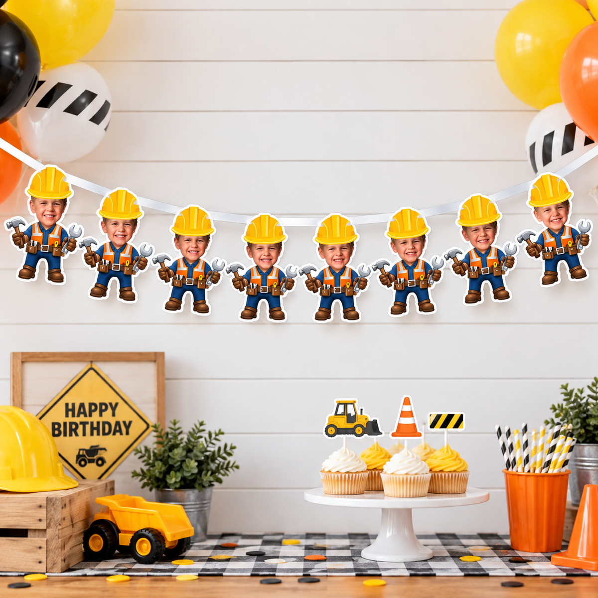 Wide construction birthday party scene featuring a personalized photo banner displayed above cupcakes party decor and construction themed decorations