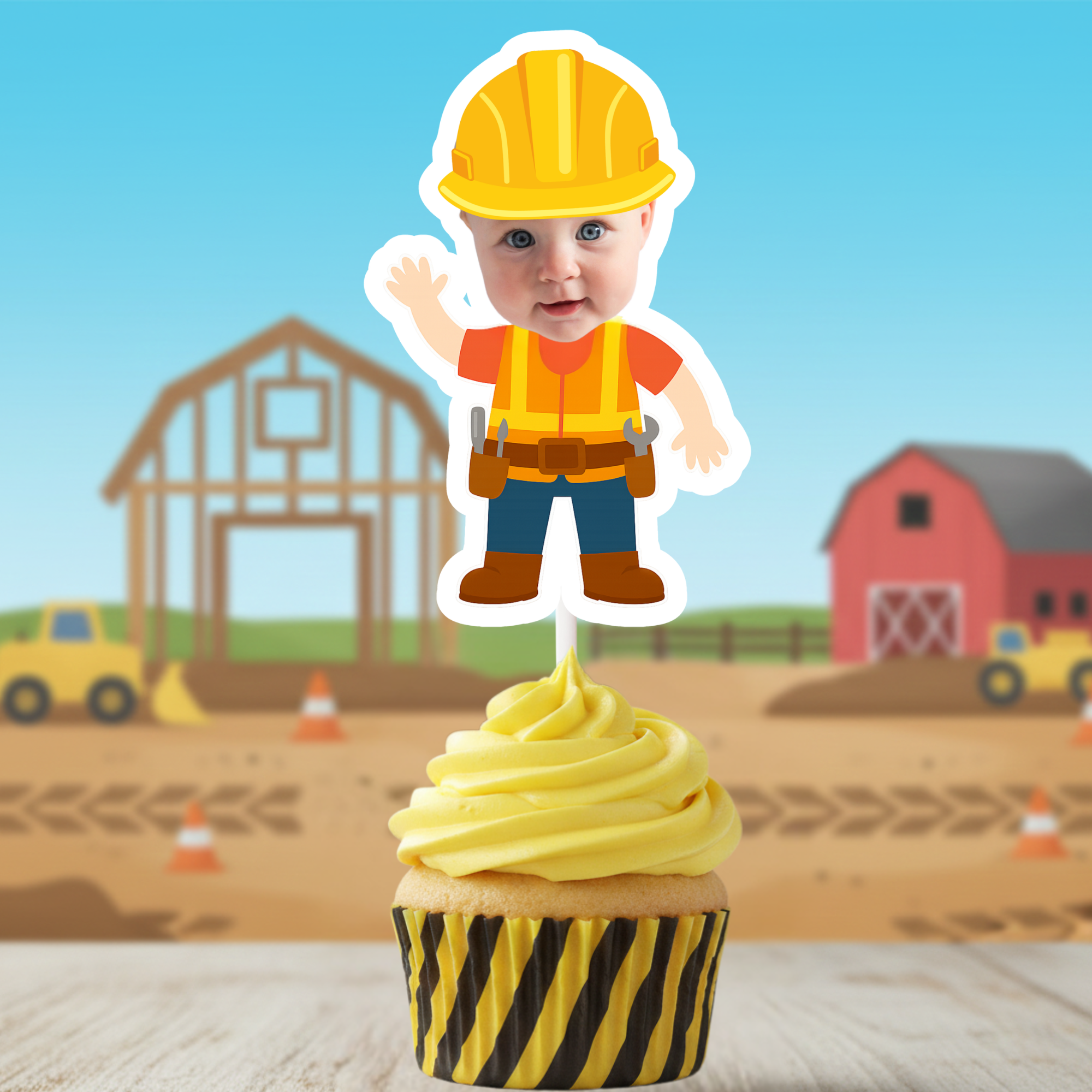 Cupcake with construction-themed topper featuring a child in a hard hat against a construction site background.