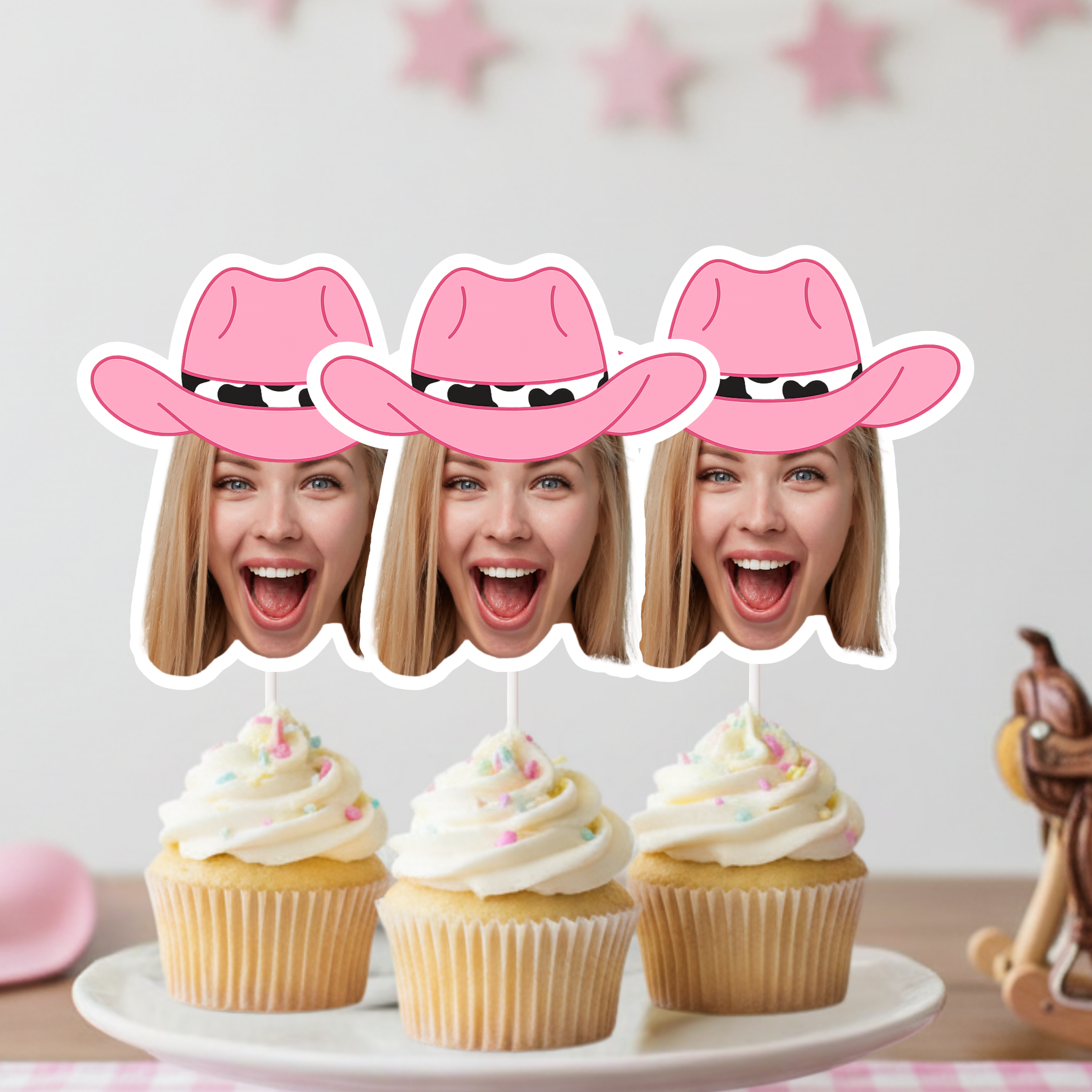 Custom cowgirl bachelorette party photo cupcake toppers featuring personalized face cutouts and pink western hats, designed for bride squad desserts, girls trip party decor, and western themed bachelorette celebrations.