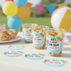 Glossy custom pool party birthday stickers personalized with name and age displayed on clear plastic cups filled with snacks. This splash bash themed design features bright aqua water graphics and tropical accents, perfect for summer birthday party favors. These die cut party stickers are ideal for labeling cups, treat containers, and dessert table decorations.